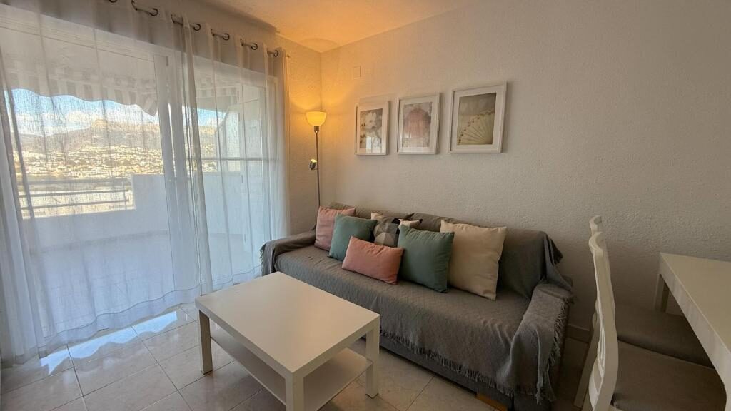 Apartment living room with sofa bed and terrace door